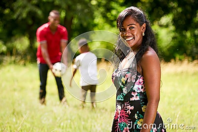 Portrait Of Happy Black Woman Looking At Camera With Family Stock Photo