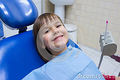 A portrait of a happy child in a dental chair Stock Photo