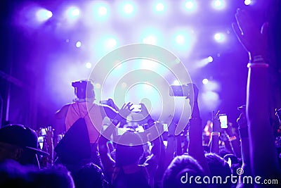 Portrait of happy crowd enjoying at music festival Editorial Stock Photo