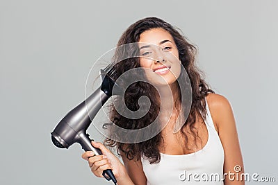 Portrait of a happy cute woman dries her hair Stock Photo