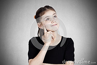 Portrait of a happy daydreaming little girl Stock Photo