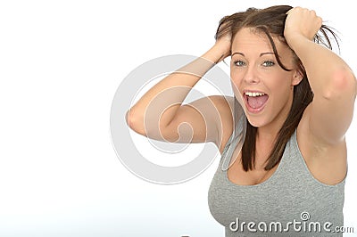 Portrait of a Happy Excited Attractive Young Woman Smiling and Pulling Hair Stock Photo