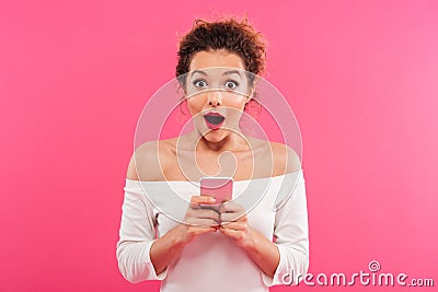 Portrait of a happy excited girl holding mobile phone Stock Photo