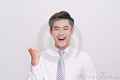 Portrait of happy excited young asian businessman. Stock Photo