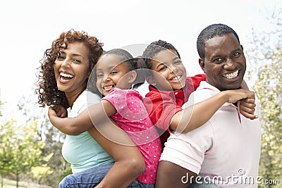 Portrait of Happy Family In Park Stock Photo