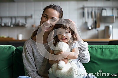 Portrait of happy family single mother and kid daughter embracin Stock Photo