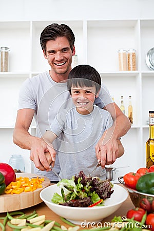Portrait of a happy father cooking with his son Stock Photo