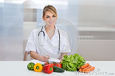 Portrait of happy female dietician Stock Photo