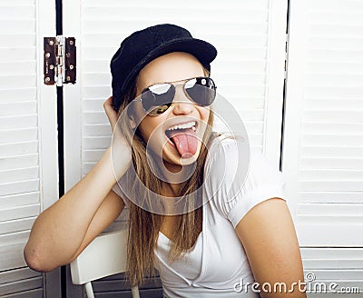 Portrait of happy funny teenage girl having breakfast and reading journal Stock Photo