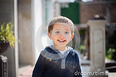 Portrait of happy joyful laughing beautiful little boy Stock Photo