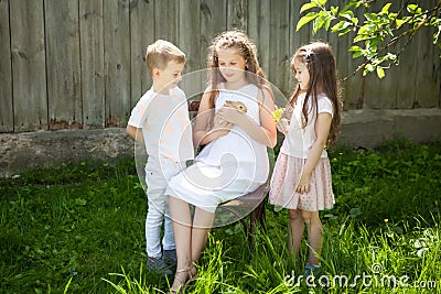 Portrait of happy kids with adorable rabbit Stock Photo