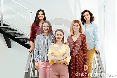 Portrait of happy ladies on stairs. Women power concept Stock Photo