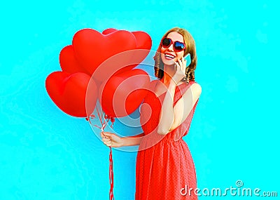 Portrait happy laughing woman talks on phone with an air balloons Stock Photo