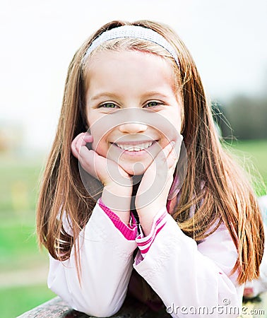 Portrait of a happy liitle girl Stock Photo