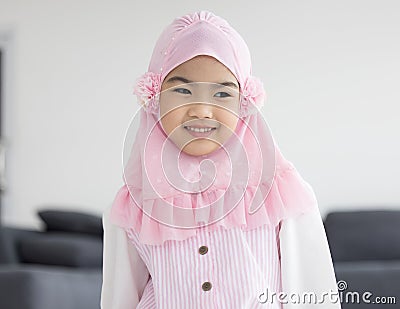 Portrait of happy little muslim girls child with hijab dress smi Stock Photo
