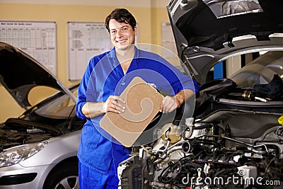 Portrait, happy man and mechanic with checklist on engine of car, repair or maintenance. Smile, technician and person Stock Photo