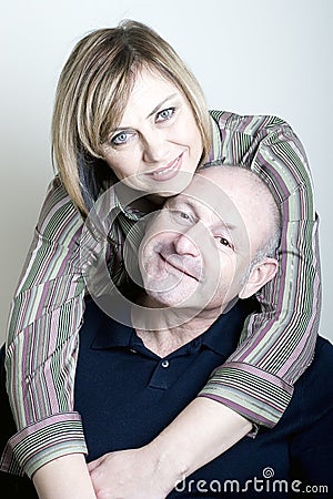 Portrait of happy middle age couple smiling Stock Photo