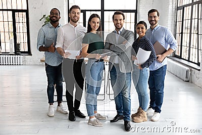Portrait of happy millennial diverse professional team in loft office Stock Photo