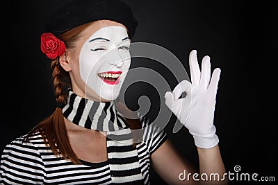Portrait of a happy mime comedian showing OK Stock Photo