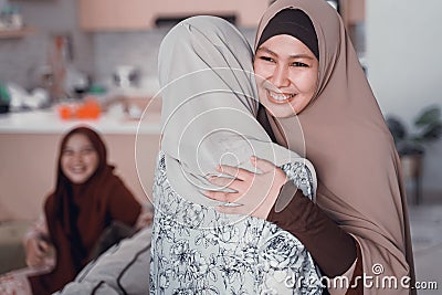 Mother hug her daughter during ramadan visit Stock Photo