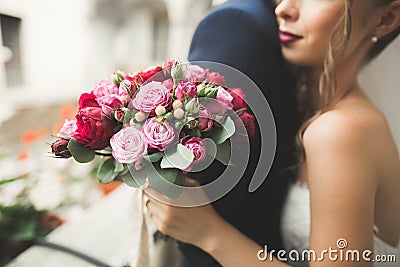 Portrait of happy newly wedding couple with bouquet Stock Photo