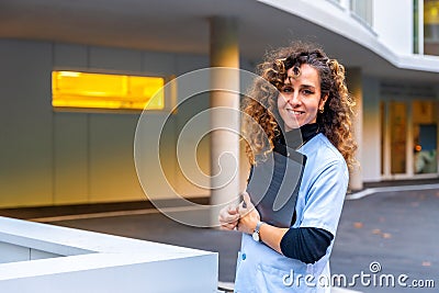 Portrait of a happy nurse outside the hospital Stock Photo