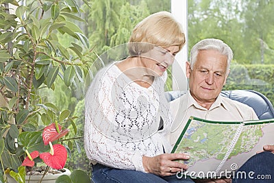 Portrait of a happy old couple analysing map Stock Photo