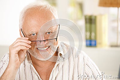 Portrait of happy older man wearing glasses Stock Photo