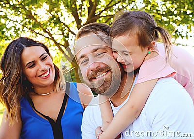 Portrait of happy parents with little daughter Stock Photo