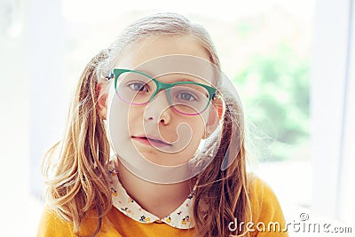 Portrait of happy pretty smiling teen girl in glasses Stock Photo