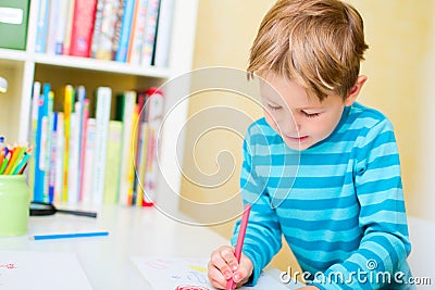 Portrait of happy schoolkid at home Stock Photo