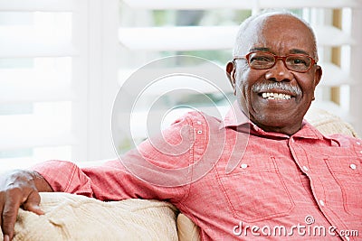 Portrait Of Happy Senior Man At Home Stock Photo