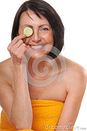 Portrait of happy senior woman with cucumber Stock Photo