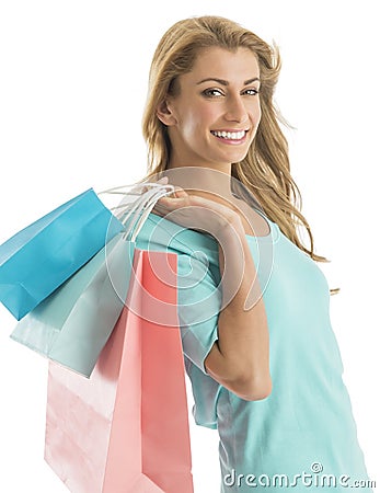 Portrait Of Happy Shopaholic Woman Carrying Shopping Bags Stock Photo