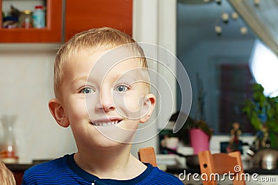 Portrait happy smiling blond boy child kid preschooler at home Stock Photo