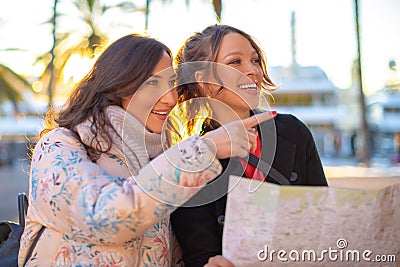 Portrait of happy smiling tourists looking at the map Stock Photo