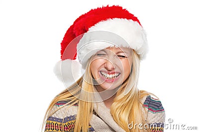 Portrait of happy teenage girl in santa hat laughing Stock Photo