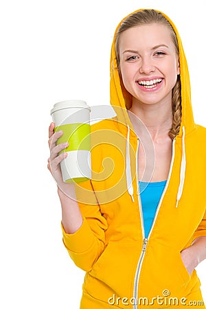 Portrait of happy teenager girl holding coffee cup Stock Photo