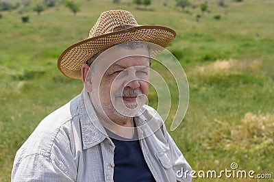 Portrait of happy Ukrainian peasant on a spring pasture Stock Photo