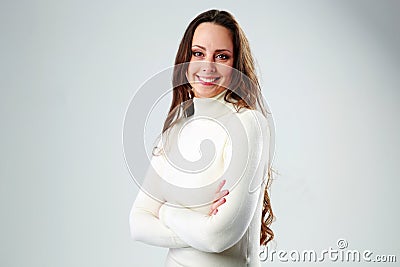Portrait of a happy woman with arms folded Stock Photo