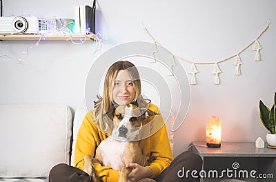 Portrait of a happy woman with her staffordshire terrier dog. Stock Photo