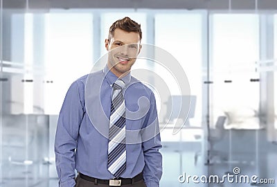 Portrait of happy young businessman at office Stock Photo