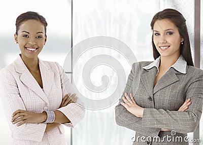 Portrait of happy young businesswomen in office Stock Photo