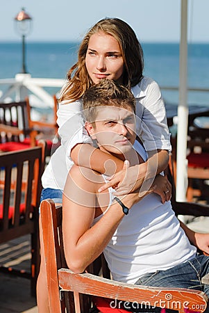 Happy young couple hugging each other at sea beach Stock Photo