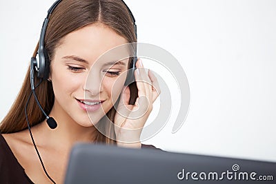 Portrait of happy young support phone operator with headset. Stock Photo