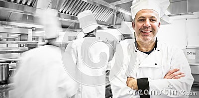 Portrait of head chef posing proudly in kitchen Stock Photo