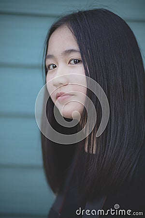 Portrait headshot of asian teenager looking with eyes contact to camera Stock Photo