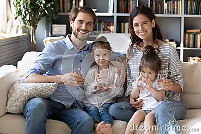 Portrait of healthy young family recommend water drinking Stock Photo