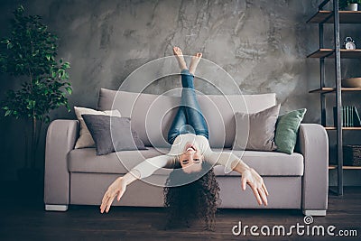 Portrait of her she nice attractive lovely charming positive cheerful cheery wavy-haired girl having fun lying divan in Stock Photo