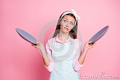 Portrait of her she nice attractive pretty sad hesitant tired bored brown-haired waitress holding in hands two plates Stock Photo